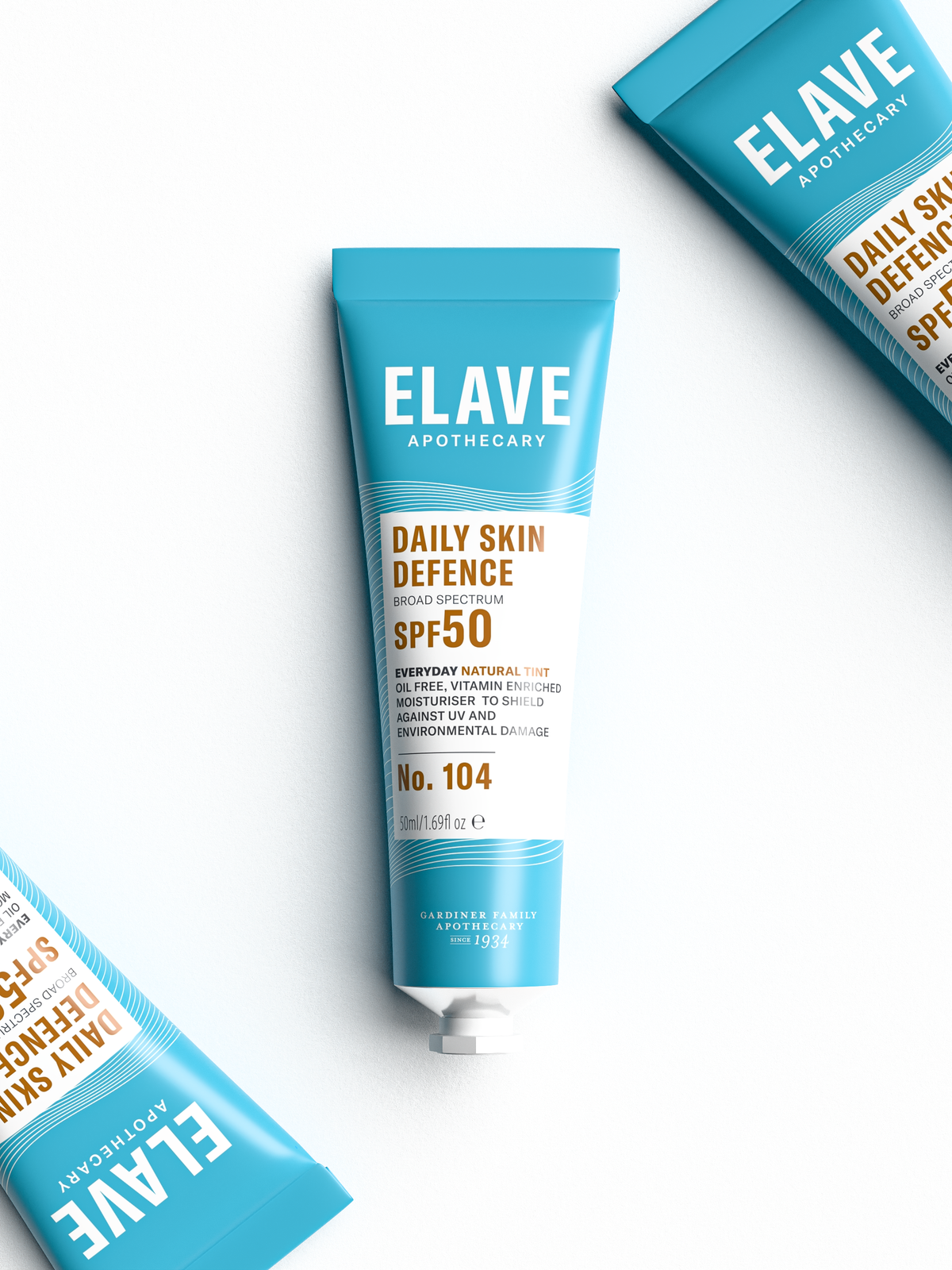 Three Elave Daily Skin Defence SPF50 tubes laid flat, one centred and two at the corners
